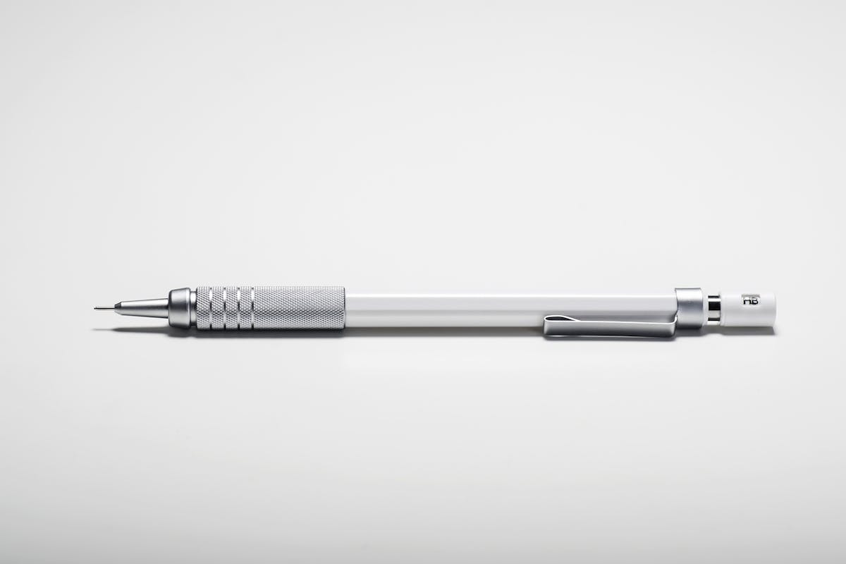 A pencil sitting on a white backround