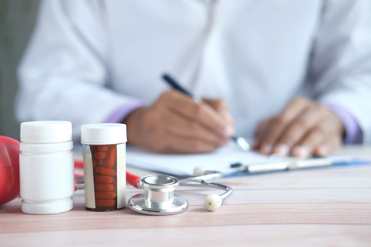 A doctor writing up a document for prescription meds